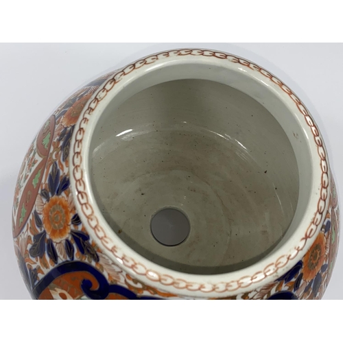 413 - A Japanese Imari pattern jardiniere / planter, the base having central drainage hole and 4 further h... 