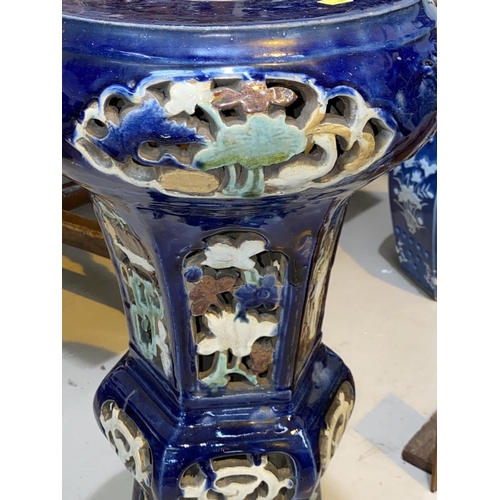 418 - A large Chinese blue jardiniere stand with pierced floral decoration, hexagonal column and circular ... 