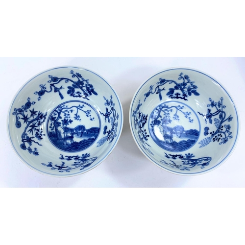 411 - Apair of Chinese yellow glaze bowlswith exterior panels depicting vases and animals, blue and white ... 