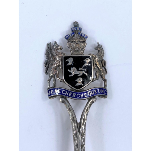708A - A hallmarked silver teaspoon with ornate crest terminal, the bowl with enamel of The Old Canonbury T... 
