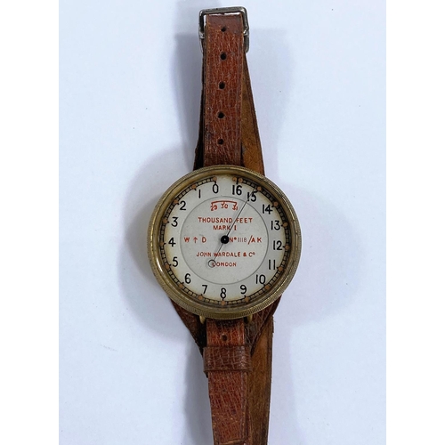 170 - A WWI Royal Flying Corps wrist worn brass cased Altimeter by John Wardale & Co, London, on brown... 