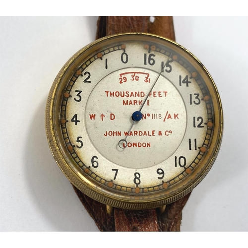 170 - A WWI Royal Flying Corps wrist worn brass cased Altimeter by John Wardale & Co, London, on brown... 