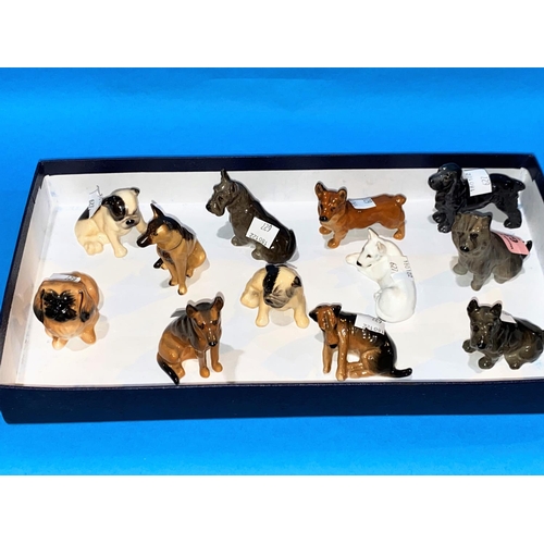 627 - Twelve miniature Royal Doulton figures of dogs
