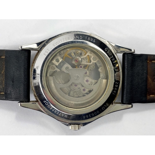 665 - A Rotary Automatic skeleton face open back gent's wrist watch on black leather strap