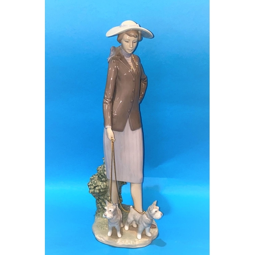 594 - A large Lladro figure, woman and 2 dogs, height 35cm
