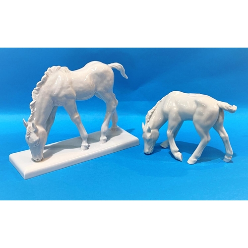 597 - A modern Meissen blanc de chine model of a horse, length 19cm;  a similar German figure of a horse
