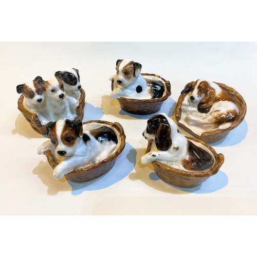 625 - Five Royal Doulton groups, puppies in baskets