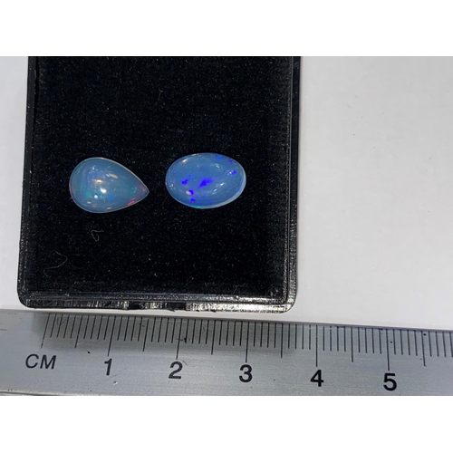 654 - Two unmounted opals, 1 oval, the other tear shape, total weight 3.24 carats
