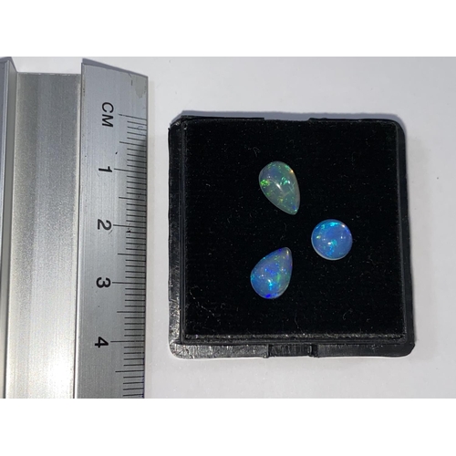 655 - Three unmounted opals, two tear shaped and one circular, total weight 2.52 carats