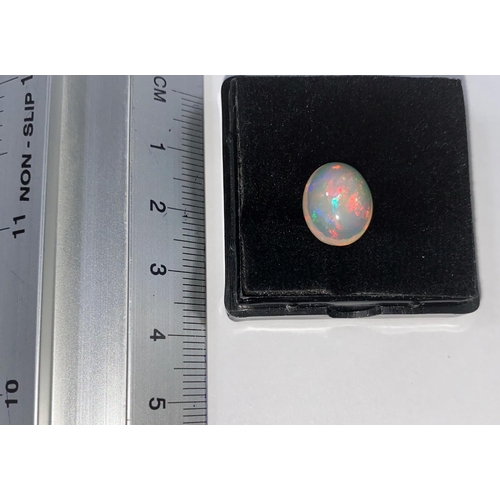 656C - An unmounted oval opal, weight 3.97 carats