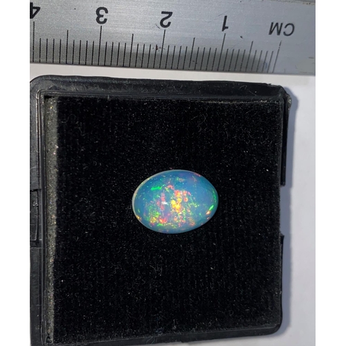 656D - An unmounted oval opal, weight 3.42 carats