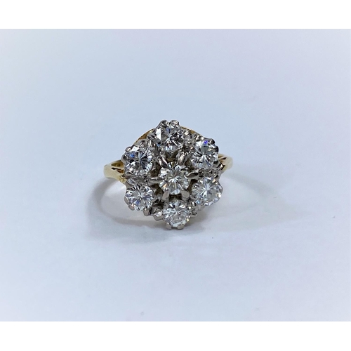 672 - A yellow metal ring with 7 old cut diamonds in cluster setting, stamped '18 ct', size H