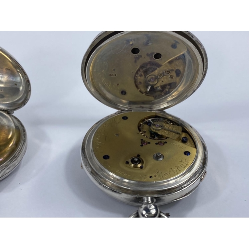 687 - A hallmarked silver pocket watch, open face and key wound, by John Taylor, Rochdale; a similar watch