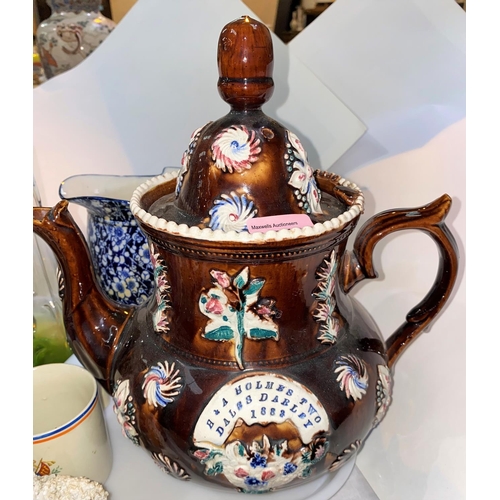 534 - A large treacle glazed barge teapot 