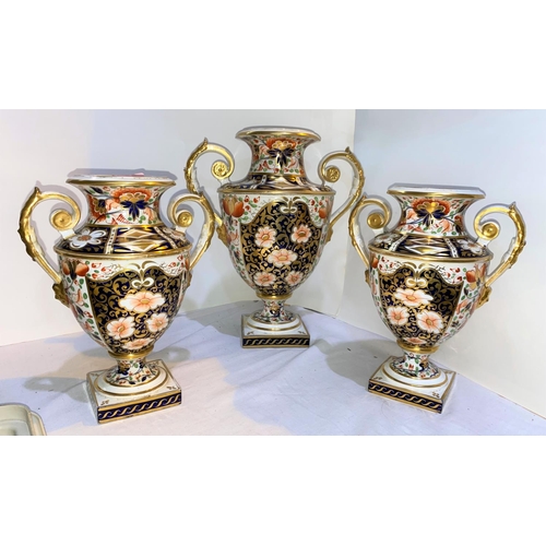 546 - A 19th century Crown Derby garniture of 3 classical urn shaped vases with twin handles and pedestal ... 