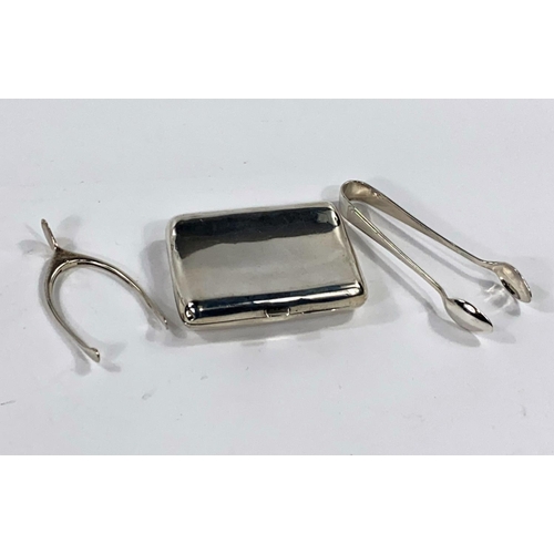 685 - A hallmarked silver cigarette case, Birmingham 1907; a hallmarked silver pair of wishbone tongs; ano... 
