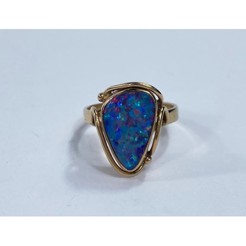 645a - A yellow metal dress ring stamped 9ct set with an asymmetrical black opal coloured stone, 4gm, size ... 