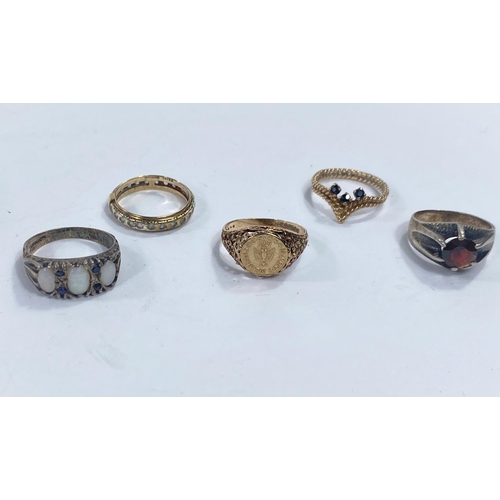 646b - A 9 carat hallmarked gold ring set with a small Mexican coin, 2.2gm; 4 other rings