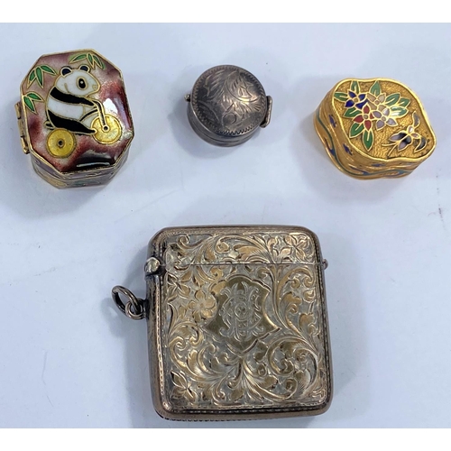 720 - A hallmarked silver vesta case, a small white metal pill box and 2 other miniature enamel boxes