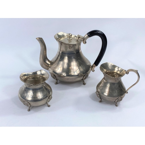 726B - A white metal tea service in continental style, stamped silver to base.