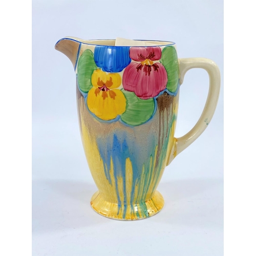 544 - A 1940's Clarice Cliff jug decorated with pansies and dripware, black printed mark for Newport potte... 