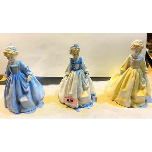 610 - Three Royal Worcester figures: Grandmother's Dress (colour variations), 17cm