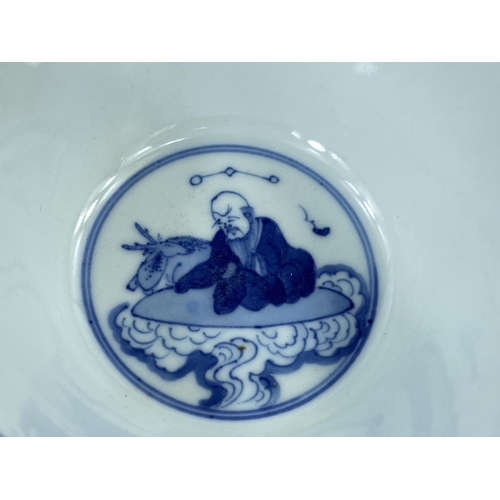 420 - A Chinese ceramic blue and white rice bowl decorated with Chinese text, sages etc, with six characte... 