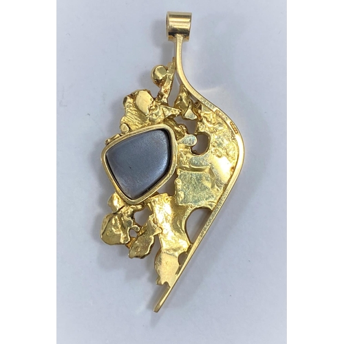 717A - A 1970’s 18 carat gold Brutalist pendant set asymmetrical black opal, length 4.7cm, 10.3gm, initiall... 