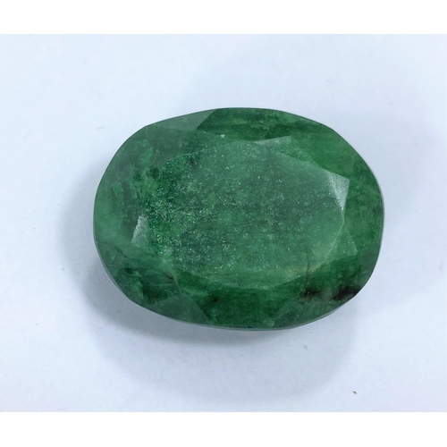 718b - A large unmounted emerald with facetted cuts, approximately 65 carats, 15.5gm, 29mm length