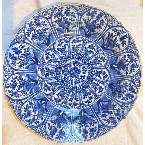 422 - A large Chinese blue and white Qianshi period charger with detailed floral decoration, marks to base... 