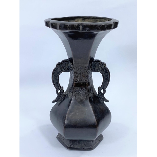 433 - A Chinese bronze hexagonal waisted vase with 2 handles, height 26cm