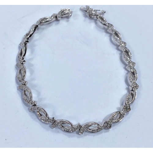 715c - A 9 carat white gold lady’s bracelet with intertwined horn shaped links with inset diamond chi... 