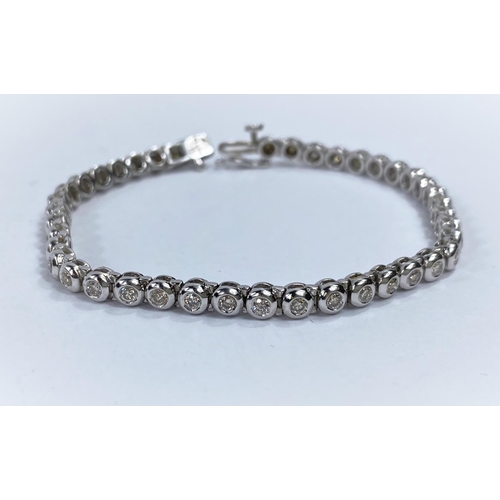 716a - A 9 carat white gold ‘Tennis Bracelet’ set 42 diamonds (approximately 2 - 3 carats, each... 