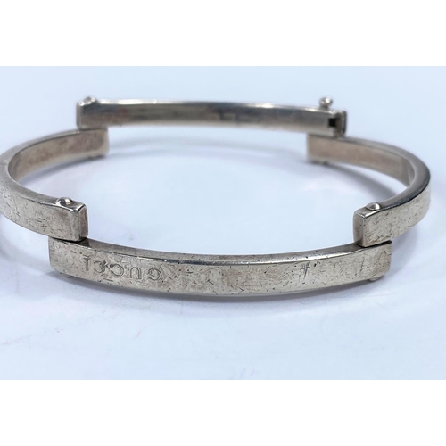 718a - A vintage white metal pinioned bracelet stamped 925 in 4 sections, etched Gucci, Made in Italy, 34gm