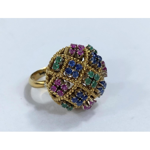 704 - A lady's cocktail ring set groups of coloured stones in domed mount, continental, marked '750', gros... 