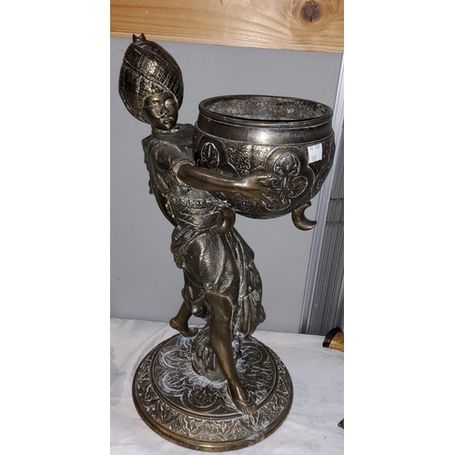 102 - A bronzed metal group depicting a boy in turban and robe, holding a large bowl, height 45 cm