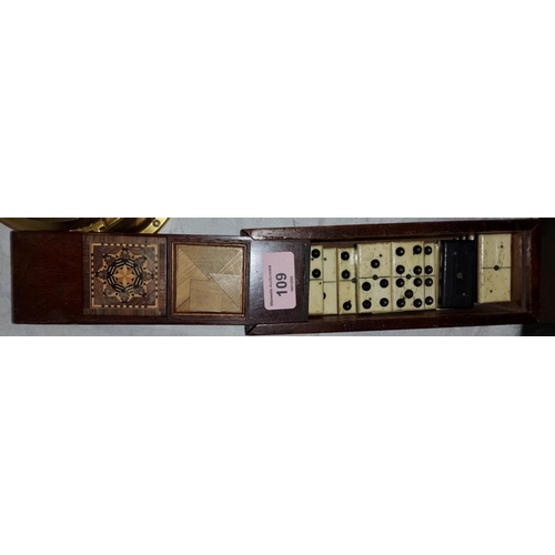 109 - A selection of ebony and ivory coloured dominoes in slide case and a wooden highly detailed inlaid b... 