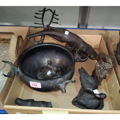 114 - A planished bronze circular bowl with stag's head mounts and 6 bronzed animal figures