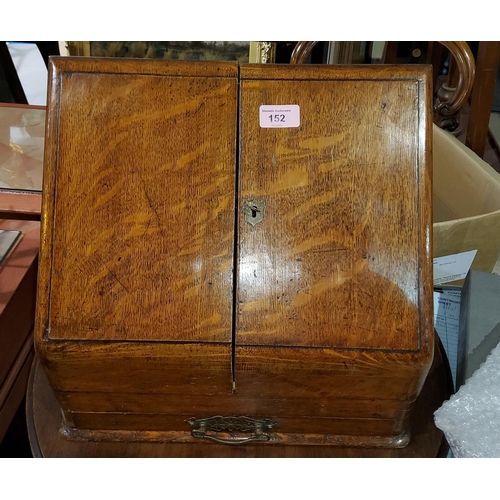 152 - An Edwardian golden oak slope front correspondence box with fitted interior and base drawer, width 3... 