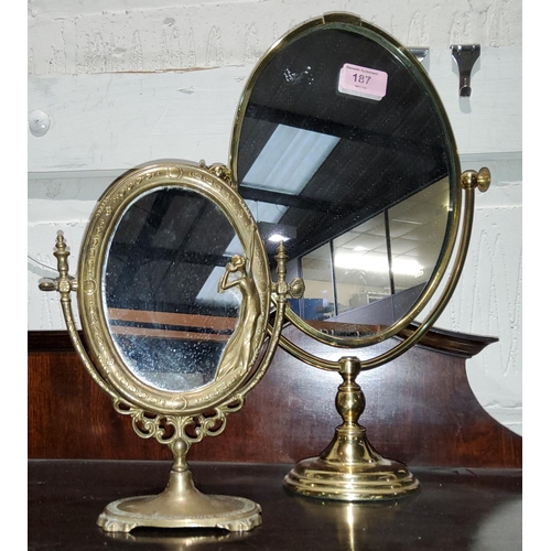 187 - A brass Art Nuveau style oval mirror on stand & another similar mirror.