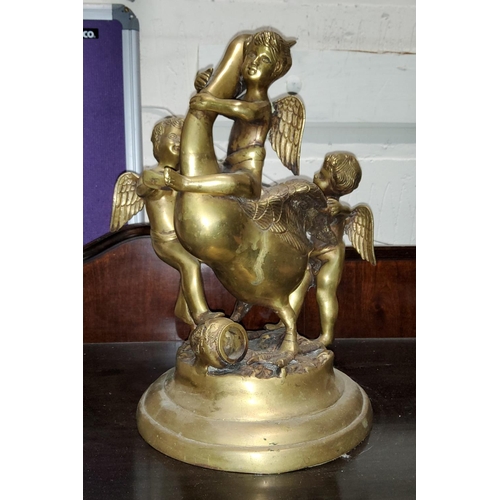 189 - A brass group depicting cherubs playing with a swan, height 36cm.