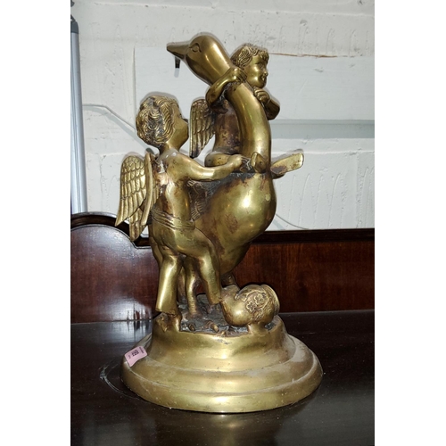 189 - A brass group depicting cherubs playing with a swan, height 36cm.