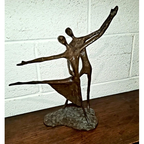 190 - A bronze abstract group of a couple dancing, in a simplified stick like form, height 40cm.