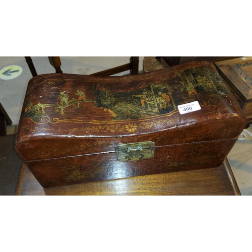 400 - A modern box decorated in the Chinese manner withcushioned lid with lacquer effect details, metal ha... 