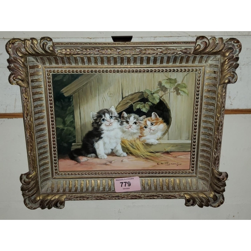 779 - G Williams: oil on board, 3 kittens in small wooden hut, in the manner of Julius Adams, signed, gilt... 