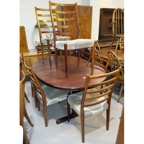 803 - A 1960's rosewood dining suite comprising oval extending dining table, one leaf, extended length 210... 