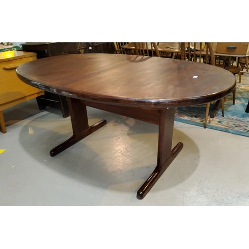 803 - A 1960's rosewood dining suite comprising oval extending dining table, one leaf, extended length 210... 