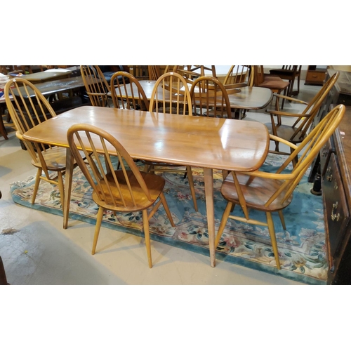 804 - A 1960's Ercol light elm dining suite comprising rounded rectangular table, length 151cm and 4 high ... 