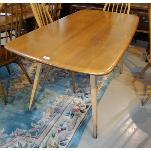 804 - A 1960's Ercol light elm dining suite comprising rounded rectangular table, length 151cm and 4 high ... 