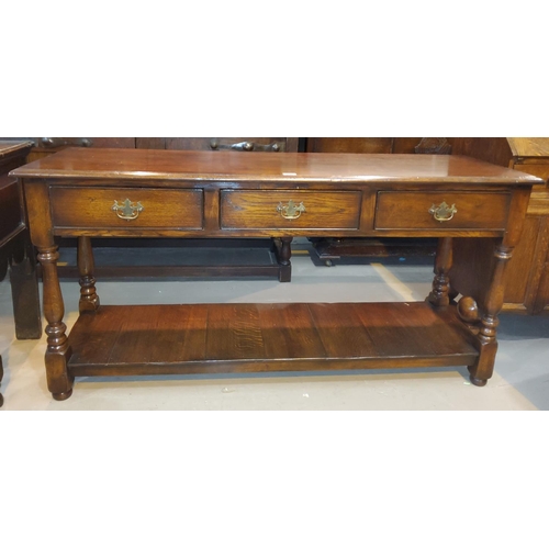 813 - An 18th century style distressed oak dresser base in the manner of Titchmarsh & Goodwin, with 3 ... 